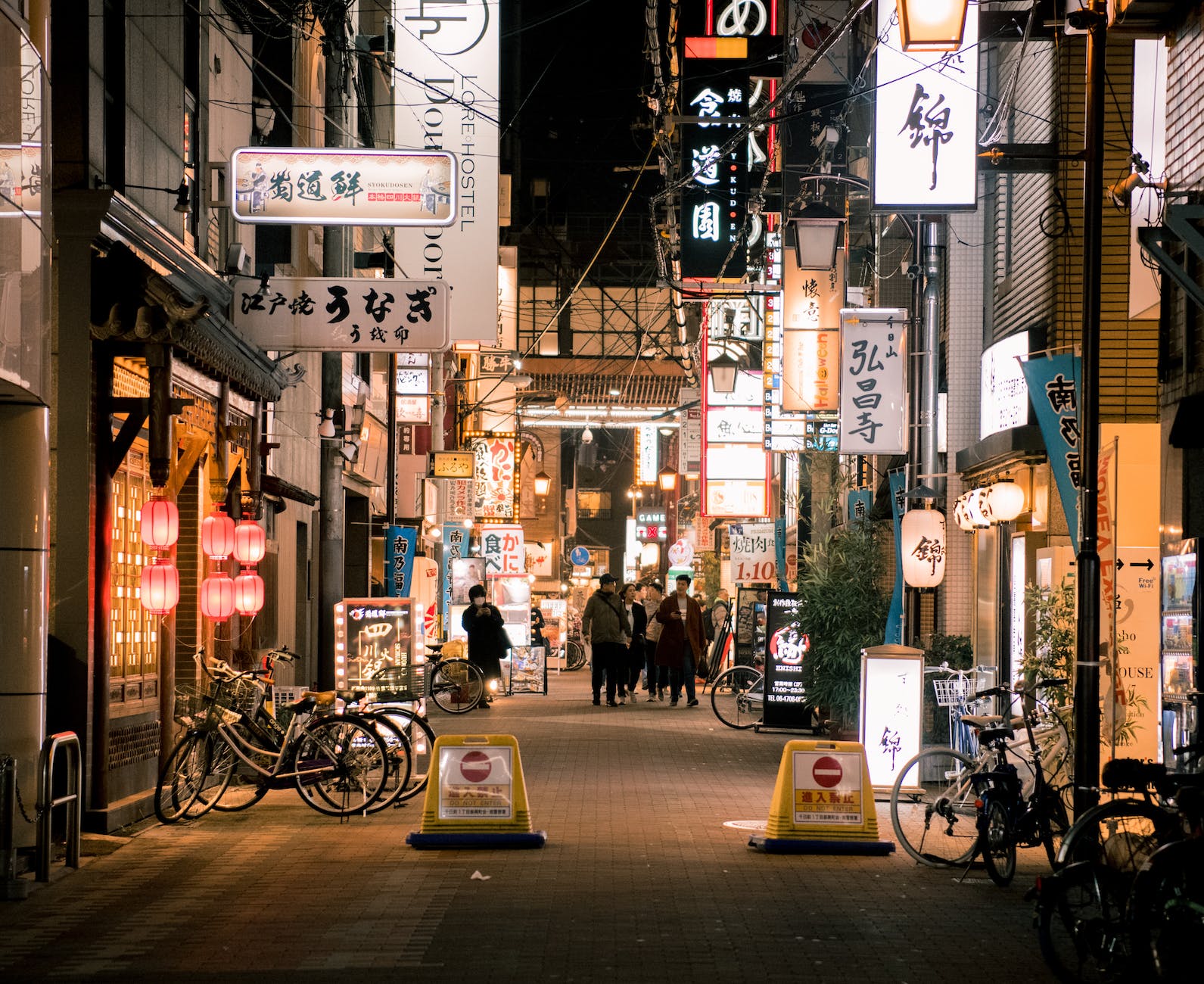 photo of people walking on alley